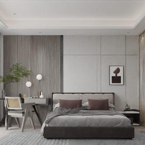 Op de afbeelding: Een moderne slaapkamer met een grijs en wit kleurenschema. Het bed heeft een grijs hoofdeinde en een grijs en wit gestreept dekbed. Er is een klein bureau met een stoel in de hoek van de kamer. De muren zijn versierd met een ingelijst abstract kunstwerk.