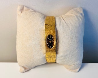 RARE : montre-bracelet vintage pour femme en plaqué or avec cadran rotatif TIGERS EYE des années 1960. Bracelet intégré. (Cadran rare !!! Fonctionne !!!, mécanique)