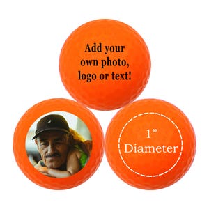 Gepersonaliseerde golfballen op maat oranje zwart licht