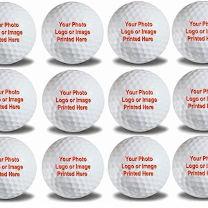 May include: Twelve white golf balls with the text "Your Photo Logo or Image Printed Here" printed in orange on each ball.