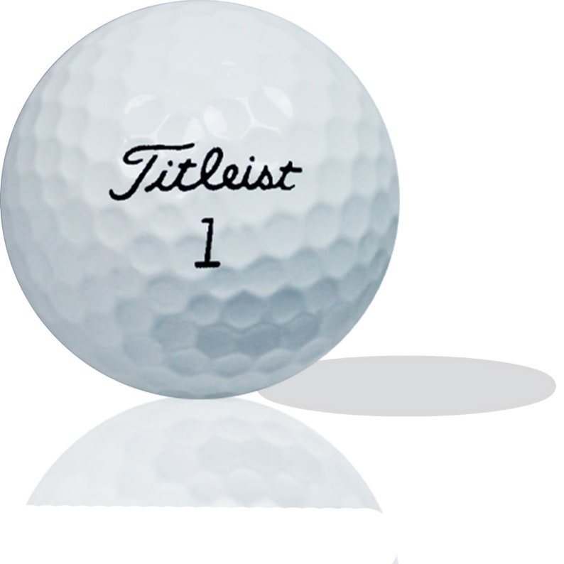 Puede incluir: Una bola de golf blanca con el texto "Titleist 1" impreso en ella.
