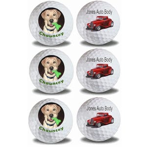 May include: Set of three white golf balls with custom designs. One ball features a yellow Labrador Retriever puppy with a green chew toy, with the name "Chauncey" printed below. The other two balls feature a red vintage hot rod car with the text "Jones Auto Body" printed above.