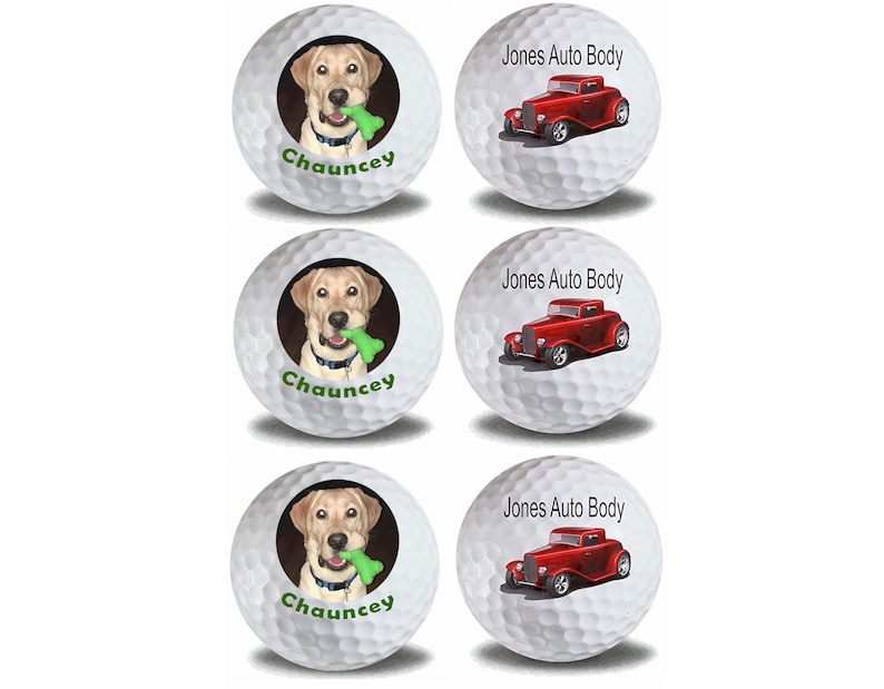 May include: Set of three white golf balls with custom designs. One ball features a yellow Labrador Retriever puppy with a green chew toy, with the name "Chauncey" printed below. The other two balls feature a red vintage hot rod car with the text "Jones Auto Body" printed above.