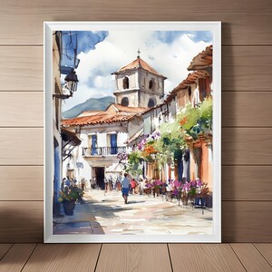 May include: Watercolor painting of a street scene in a European town. The street is lined with buildings, some of which have balconies and flowers. There is a church in the background, and people are walking on the street.