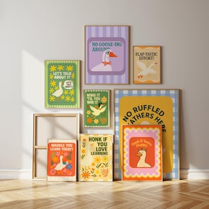 May include: A collection of framed art prints featuring whimsical goose illustrations and playful text. The prints showcase a variety of colors, including green, yellow, orange, and purple, with phrases like "No Goose-ing Around" and "Honk If You Love Learning."