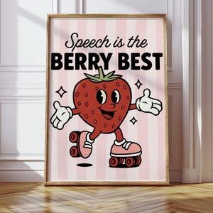 Peut inclure: Une affiche encadrée avec une fraise de dessin animé sur des patins à roulettes. La fraise rouge a une tige verte et un visage souriant. Le texte "Speech is the BERRY BEST" est au-dessus de la fraise sur un fond à rayures roses.