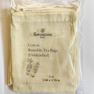 May include: A package of 5 unbleached cotton reusable tea bags, each measuring 3.94 x 3.15 inches. The bags are made by Smugglers Leaf.