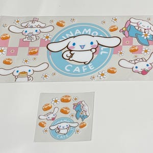 May include: Clear stickers featuring the character Cinnamoroll. The stickers include Cinnamoroll in various poses, surrounded by flowers, cinnamon rolls, and the text "Cinnamoroll Cafe" in a blue circle.
