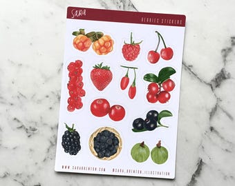 May include: A sheet of stickers featuring various berries, including blueberries, blackberries, raspberries, strawberries, cherries, and cloudberries. The stickers are white with a red border and the text "BERRIES STICKERS" is printed at the top.
