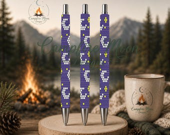 May include: Three retractable pens with a dark purple background featuring a repeating pattern of white crescent moons and small yellow stars. Each pen has a silver-toned metal tip and a silver-toned click mechanism at the top end of the barrel.