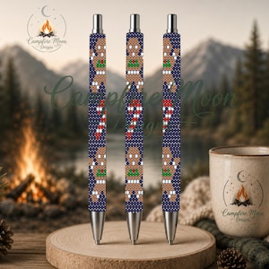 May include: Three retractable pens featuring a dark blue background with a repeating pattern of gingerbread people and candy canes. The pens have silver-toned metal tips and clips, and the barrels display a white dotted texture throughout.