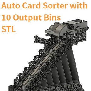May include: A gray 3D model of an Auto Card Sorter with 10 Output Bins STL featuring a complex mechanical structure with a sloped track, multiple vertical dividers, and a grid-patterned base, designed for automated card organization and sorting.