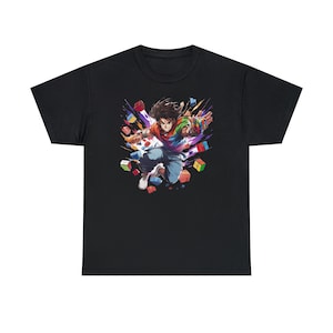 May include: A black t-shirt with a colorful graphic of a person jumping in the air with a Rubik's Cube. The person is surrounded by colorful Rubik's Cube pieces.