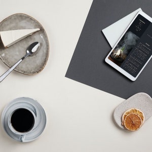 Digital recipe book shown on tablet, editable Canva format for easy customization and instant download.