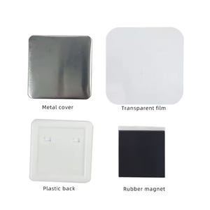 May include: A set of four components for a custom badge or button. The set includes a silver metal cover, a transparent film, a white plastic back, and a black rubber magnet.
