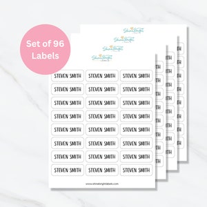 May include: A set of 96 white oval labels with black text that reads "STEVEN SMITH". The labels are arranged in rows of three on a white background. The text "Shine Bright Labels" is visible in the top right corner of the image.