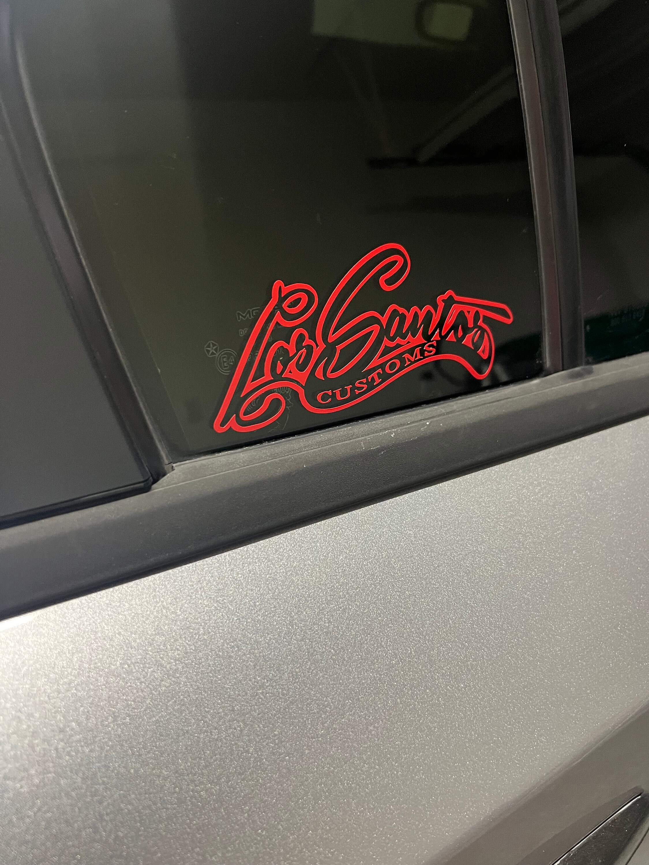 los santos customs Sticker for Sale by Rebass