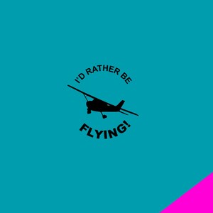 May include: A teal background with a black silhouette of a small airplane. The text "I'D RATHER BE FLYING!" is in black, arched above and below the plane. A diagonal pink stripe is in the lower right corner.