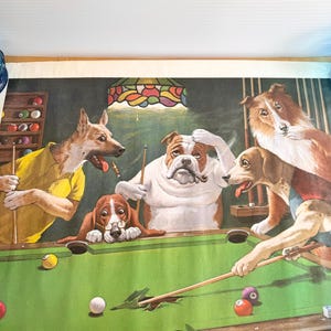 May include: A vintage print titled "Jack the Ripper" by Arthur Sarnoff. The artwork depicts five anthropomorphic dogs playing pool around a green felt table. The dogs are dressed in various outfits, with one smoking a pipe. The background features a stained-glass lamp.