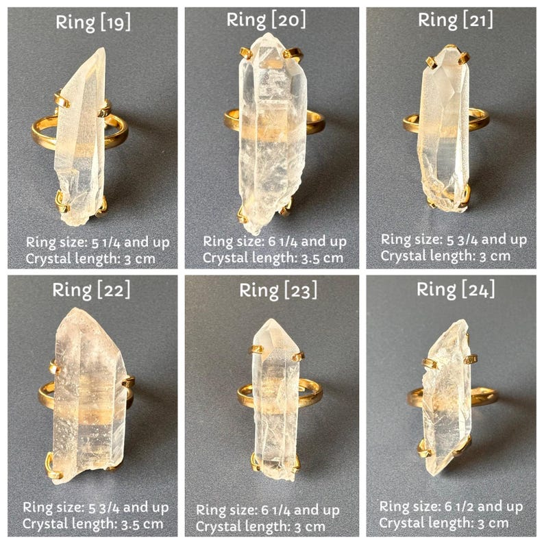 May include: Six gold rings, each with a clear quartz crystal. The crystal lengths range from 3 cm to 3.5 cm. The image text indicates ring sizes from 5 1/4 and up to 6 1/2 and up. The rings are displayed on a grey background.