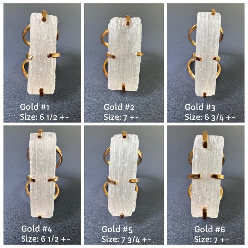 May include: Six gold-toned rings featuring rectangular, translucent white selenite crystals held by four prongs. Each ring is labelled with a number from 1 to 6 and a size ranging from 6.5 to 7.75, indicating specific variations in the crystal shape.