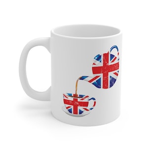 May include: White ceramic mug with a graphic of a teapot and teacup, both decorated with the Union Jack flag. The teapot is pouring tea into the teacup.