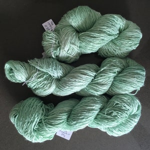 Hand dyed yarn.  2 colours: pistachio and mint. Great for knitters or crochet.  Easy wash and hard wearing.  3 skeins of each colour.