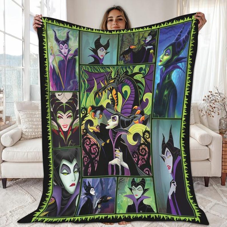 A woman is holding up a large quilt featuring a collage of images depicting various characters from the Disney movie "Maleficent".