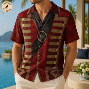 May include: A short-sleeve button-down shirt in deep red with a black center panel. The shirt features a military-inspired design with horizontal gold-toned bars and small skull emblems, a large circular gold buckle, and a subtle leaf pattern.