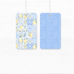 Pastel watercolor seamless pattern featuring Sicilian lemons, Amalfi Coast–inspired stripes, Santorini-style Mediterranean tiles, and delicate fruit motifs. Soft, airy colors with a hand-painted look evoke a romantic Mediterranean summer aesthetic