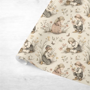 Seamless pattern in a vintage storybook toile style featuring girls picking pretty wildflowers. Soft ink and watercolor illustration in muted tones of sandy beige, pale blue, and warm grey.