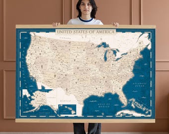 May include: A large map of the United States of America, displayed on a wooden frame. The map features a vintage design with a cream-colored background and dark blue borders. The text "UNITED STATES OF AMERICA" is at the top.