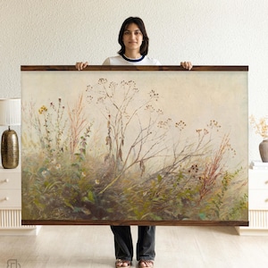 May include: A large rectangular wall art print featuring a detailed botanical illustration of wildflowers and grasses in muted tones of green, beige, and brown. The artwork is framed with a dark wood border.