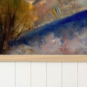 May include: A rectangular canvas print featuring an impressionistic landscape painting with visible brushstrokes in shades of deep blue, golden yellow, and soft pink. The artwork is mounted in a light-toned wooden frame and displays the initials S.M.