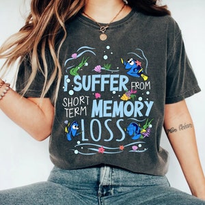 May include: A gray t-shirt with a graphic of Dory and Nemo from Finding Nemo. The graphic says "I suffer from short term memory loss".