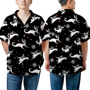May include: A black short-sleeve button-down shirt featuring an all-over print of white ghost dogs, white spiderwebs, and small orange dots. The shirt has a classic collar and a front button closure, displaying both the front and back views.