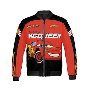 May include: Red and black Lightning McQueen bomber jacket. The jacket features a large graphic of the character Lightning McQueen on the front, with the text "Lightning McQueen" above the car. The sleeves have flame designs.
