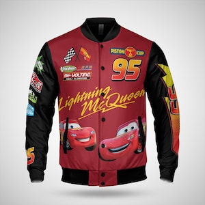 May include: Red and black Lightning McQueen bomber jacket. The jacket features the number 95, the words "Lightning McQueen", and images of the character. The sleeves are black, and the jacket has various racing-themed patches.
