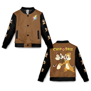 May include: Brown and black bomber jacket featuring Chip and Dale characters. The jacket has a brown front with black sleeves adorned with Chip and Dale graphics. The back of the jacket displays Chip and Dale with the text "Chip & Dale".
