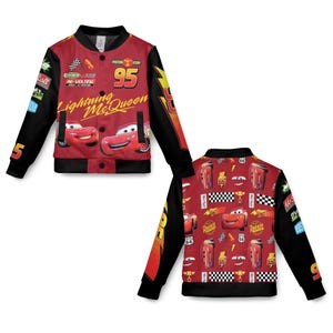 May include: Red and black Lightning McQueen bomber jacket. The front features Lightning McQueen and the number 95. The sleeves are black with racing-themed patches. The back of the jacket has a repeating pattern of Lightning McQueen and racing elements.