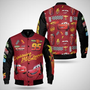 May include: A red and black Lightning McQueen bomber jacket. The front features the number 95, the words "Lightning McQueen", and cartoon images of the character. The back has a repeating pattern of Lightning McQueen, racing flags, and other racing-themed graphics.