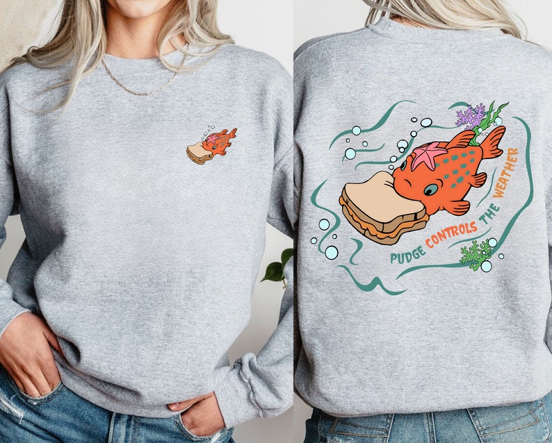 May include: Gray sweatshirt with a cartoon fish eating a peanut butter and jelly sandwich. The text on the back reads "Pudge Controls The Weather".