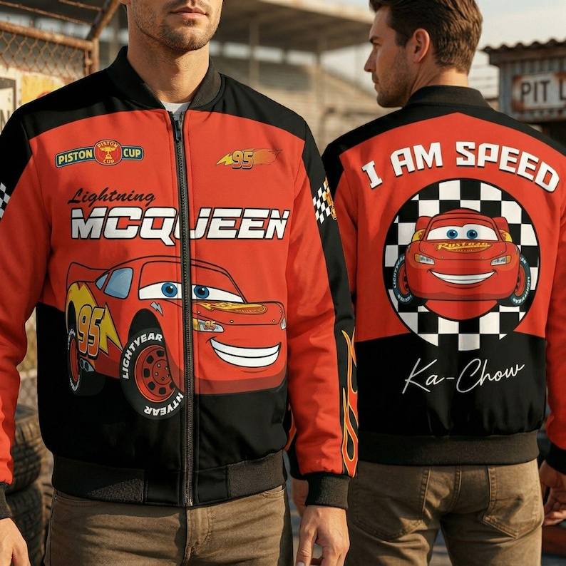 May include: Red and black bomber jacket featuring Lightning McQueen from the Cars movie. The jacket has a front zipper, the text "Lightning McQueen", "95", and "LIGHTYEAR". The back of the jacket says "I AM SPEED" and "Ka-Chow".