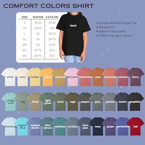 May include: A chart showing the size, width, and length measurements for a unisex garment-dyed tee shirt. The chart shows measurements in inches. The chart is accompanied by a photo of a black tee shirt being worn by a person. Below the chart is a row of 12 tee shirts in different colours, followed by two more rows of 12 tee shirts in different colours. The colours are labelled with their names.