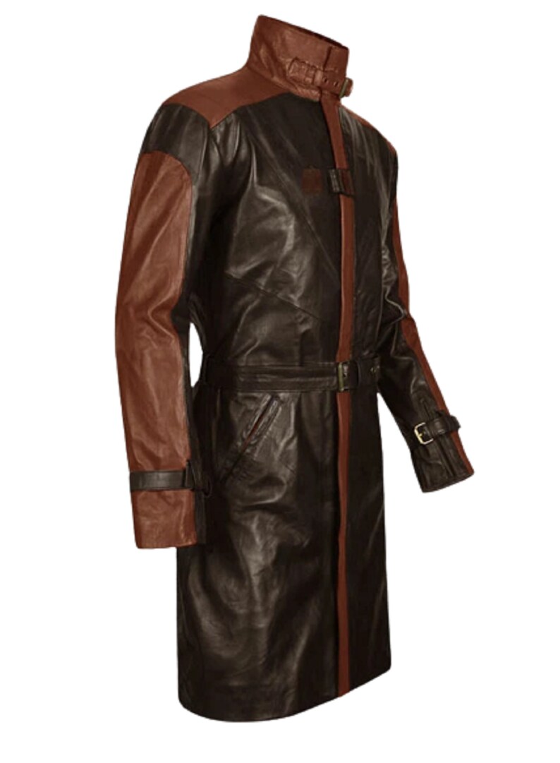 May include: A long brown leather coat with brown leather sleeves. The coat has a belt and a high collar.