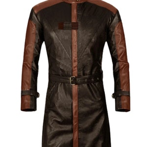 May include: A long brown leather coat with brown leather sleeves. The coat has a high collar and a belt around the waist.
