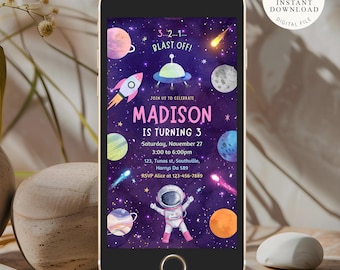 May include: A digital invitation for a child's birthday party with a space theme. The invitation features a purple background with planets, stars, and a rocket ship. The text on the invitation reads "3...2...1... BLAST OFF!" and "JOIN US TO CELEBRATE MADISON IS TURNING 3".