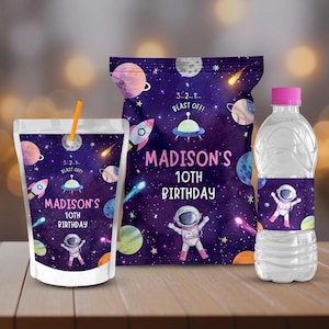 May include: A set of party favor labels featuring a space theme. The labels are printed with a purple background, stars, planets, and an astronaut. The text on the labels reads "3...2...1... BLAST OFF!" and "MADISON'S 10TH BIRTHDAY".