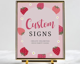 以下が含まれることがあります： 金色の枠とスタンドが付いたピンクの看板。看板には、ピンク色の「Custom Signs」という文字が書かれた白い円があります。「Create Unlimited 8x10 Party Signs」という文字が円のすぐ下にあります。看板はイチゴと白い花で飾られています。