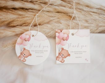 May include: Two round and square thank you tags with a pink and brown teddy bear holding pink balloons. The text on the tags reads "Thank you for showering baby with love Amanda".